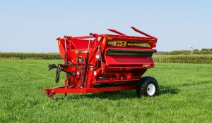 H&S 3957 left hand discharge bale processor in a field