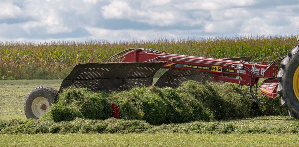 H&S 6128 twin-flex merger merging alfalfa in a field
