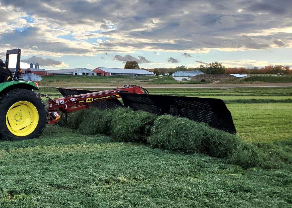 H&S 6128 Twin-Flex merger merging alfalfa in a field