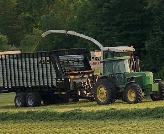 H&S HD7+4 series front and rear unload forage box in the field