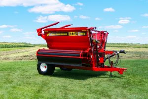 H&S 3958 right hand discharge bale processor in a field