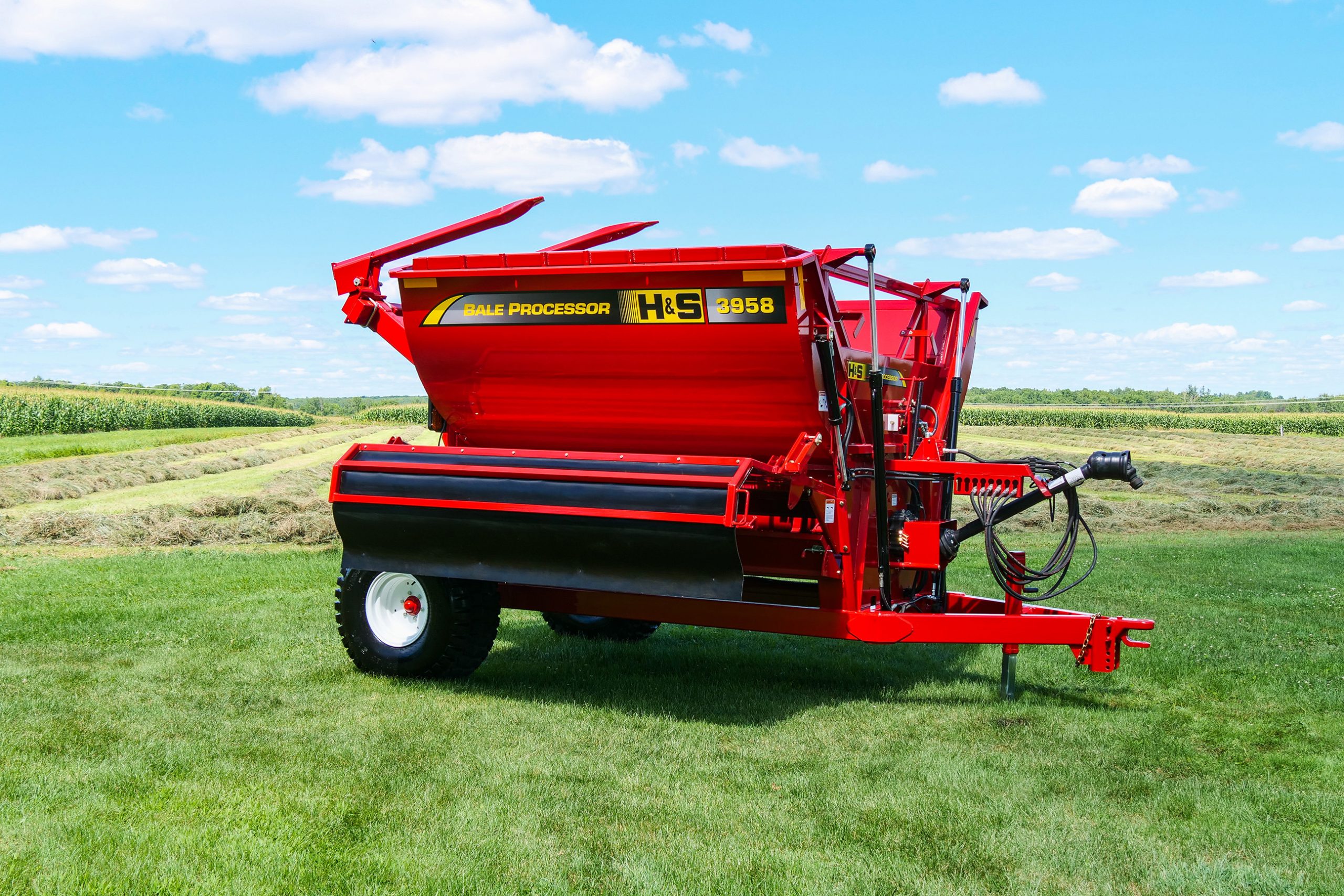 H&S 3958 right hand discharge bale processor in a field