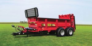 H&S 6180 PowerSpread manure spreader in a field