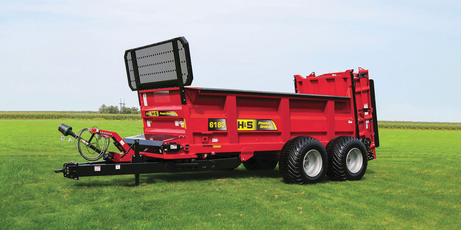 H&S 6180 PowerSpread manure spreader in a field