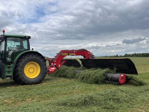 H&S 6132 Twin-Flex merger merging alfalfa in a hay field