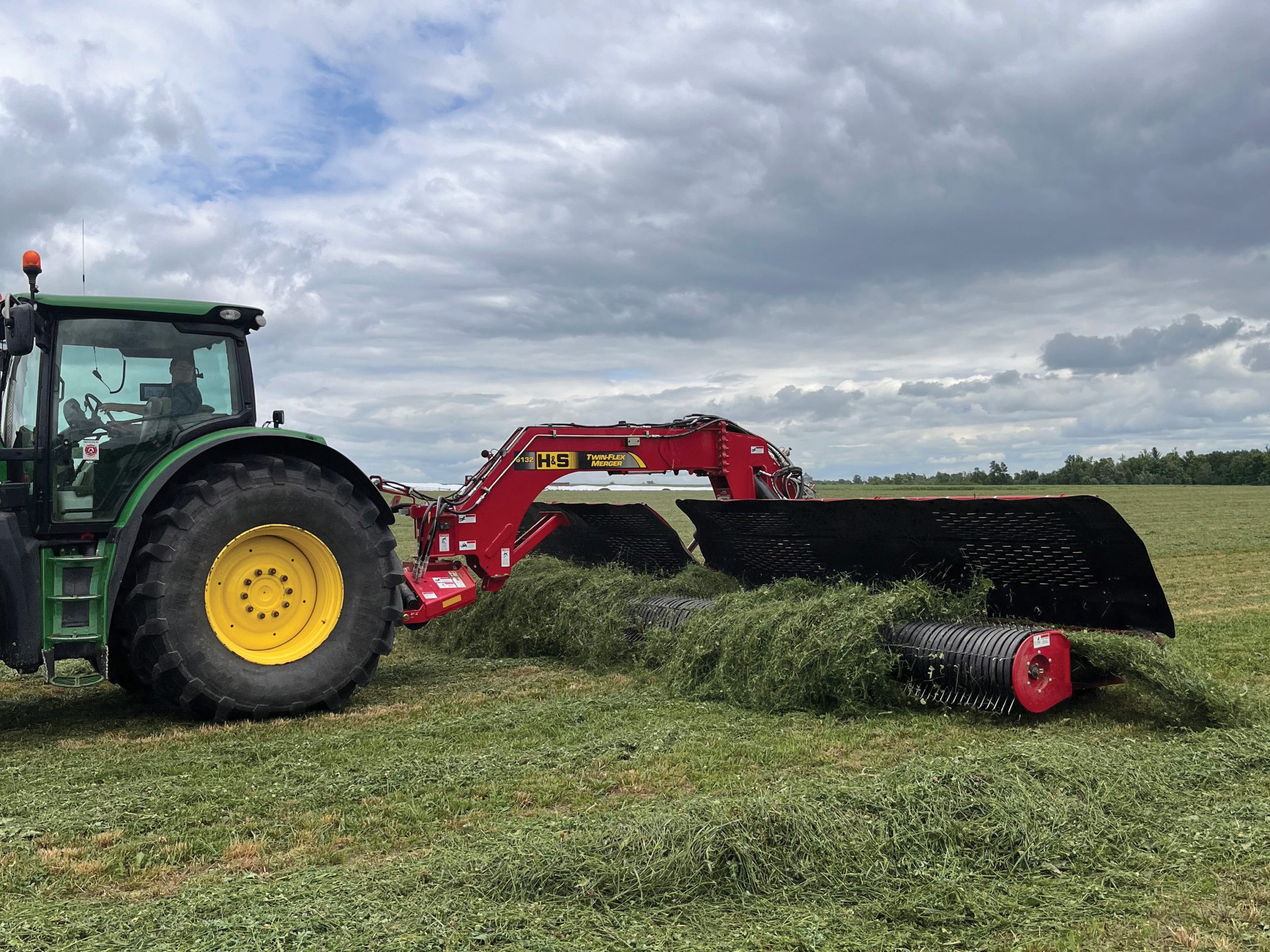 H&S 6132 Twin-Flex merger merging alfalfa in a hay field