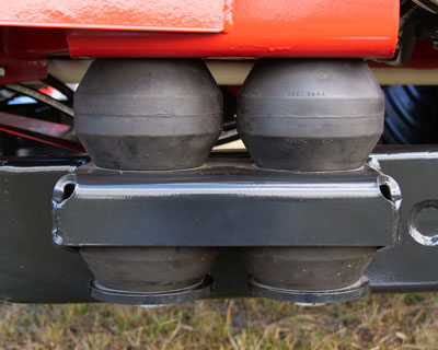 closeup of H&S 6138 PowerSpread manure spreader rubber spring suspension